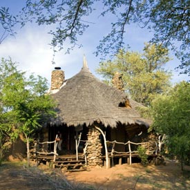 Rustic stone and thatched chalets at Kariega