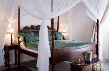 Cool, Colonial-style bedroom at Ibo Island, Mozambique