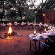 Dine around the fire in the open-air boma