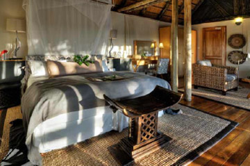 Twin-bedded luxury wood and thatch safari suites
