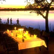 Dinner under the stars alongside the Zambezi