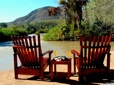Relax on the banks of the Kunene River, close to the Epupa Falls