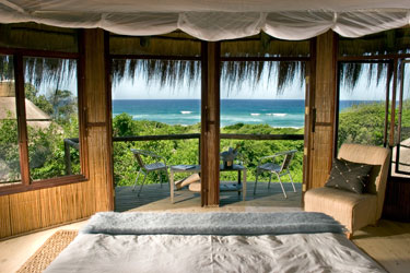 Thatched beach chalet with panoramic views of the ocean